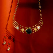 Golden Modern Necklace Set with Black Stone and Pearl Accents