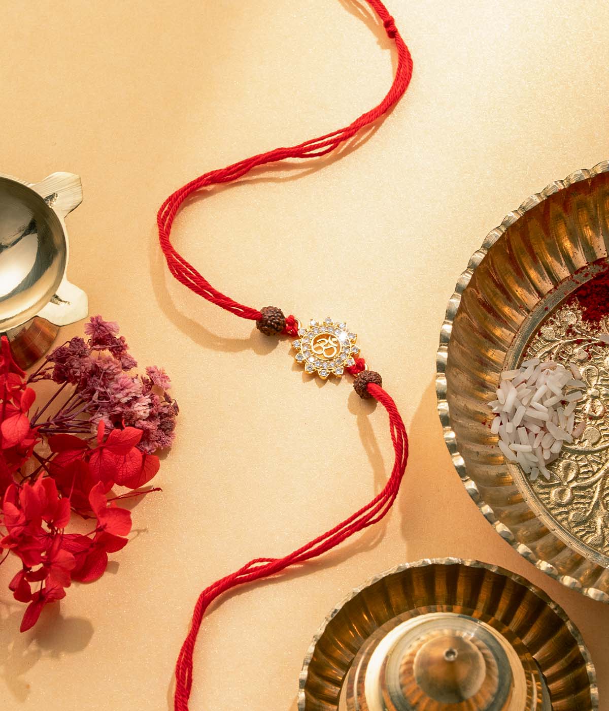 Om Sunburst Gold-Plated Rakhi